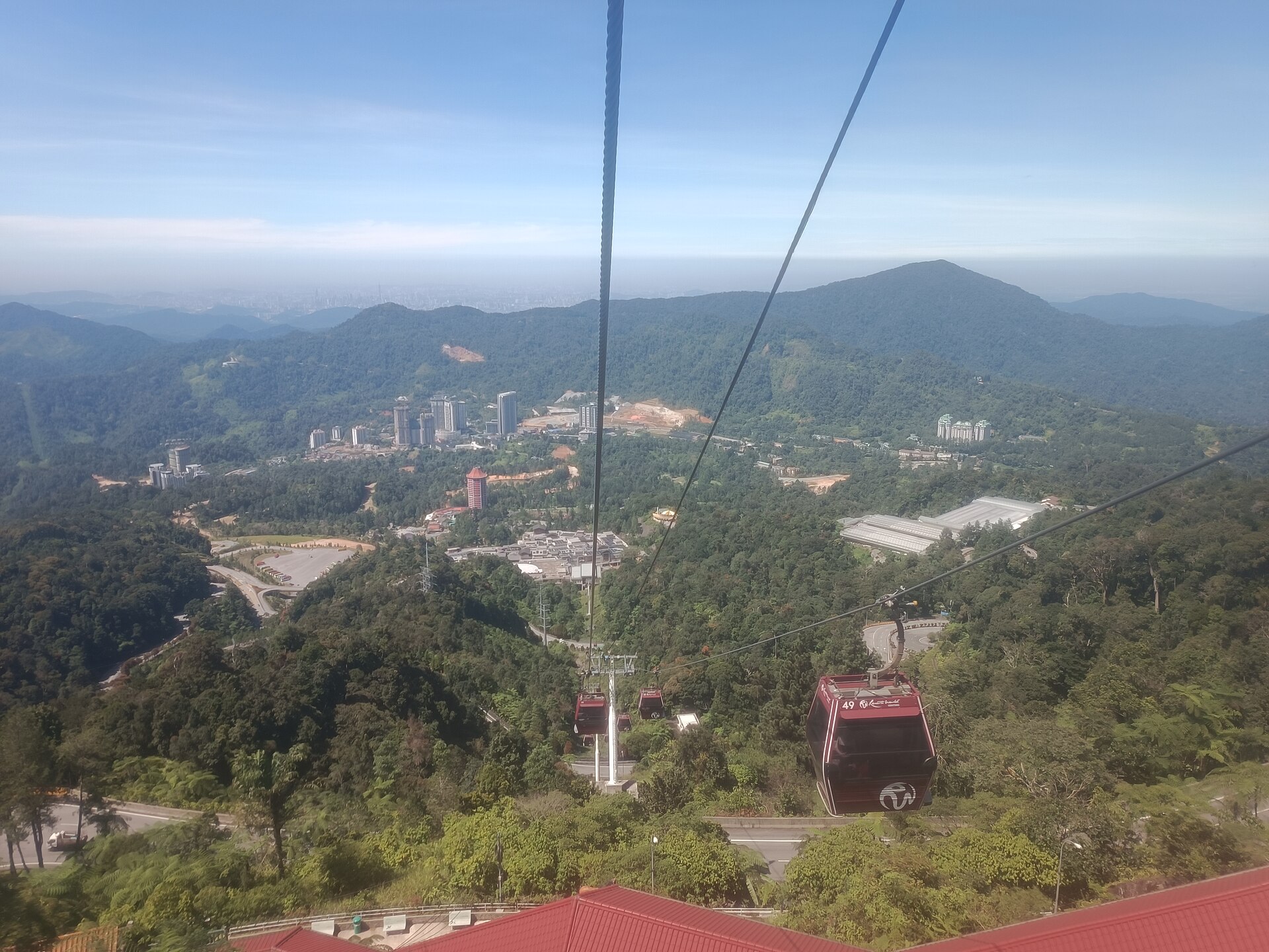 Awana SkyWay cable cars crossing the forested Genting Highlands