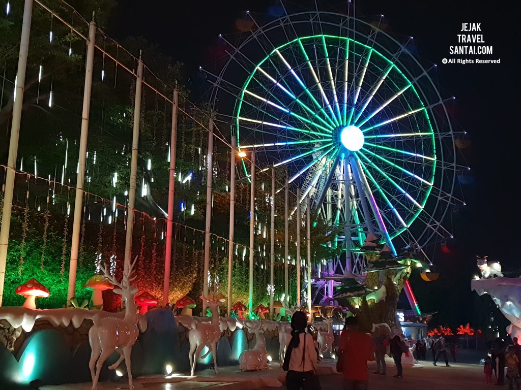 Illuminated ferris wheel and colourful digital light trees at i-City Shah Alam